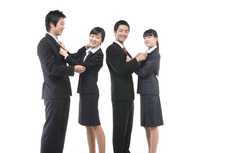 Young Asian business people in the studio - isolated on whiteの写真素材