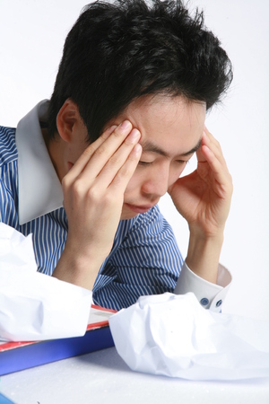 Young Asian businessman in the studio - isolated on whiteの写真素材