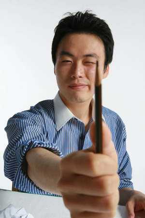 Young Asian businessman in the studio - isolated on whiteの写真素材