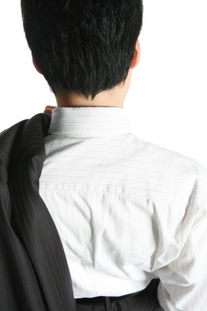 Young Asian businessman in the studio - isolated on whiteの写真素材