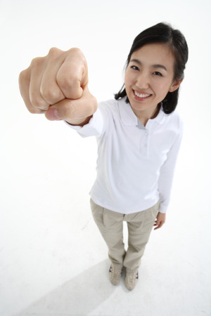 Young Asian woman posing in the studio - isolated on whiteの写真素材
