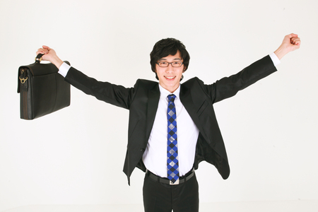 Young Asian businessman posing in the studio - isolated on whiteの写真素材