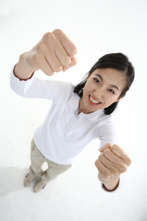 Young Asian woman posing in the studio - isolated on whiteの写真素材