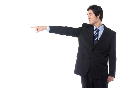 Young Asian businessman posing in the studio - isolated on whiteの写真素材