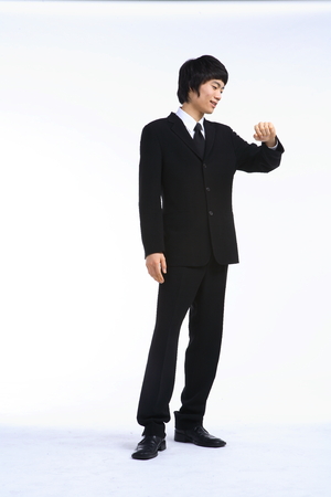 Young Asian businessman in the studio - isolated on whiteの写真素材