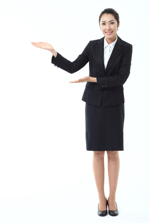 Asian businesswoman posing in the studio - isolated on whiteの写真素材
