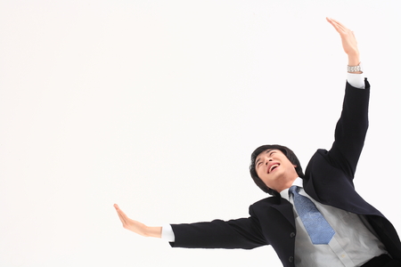 Asian businessman posing in the studio - isolated on whiteの写真素材