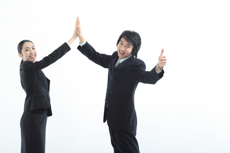 Asian business people posing in the studio - isolated on whiteの写真素材