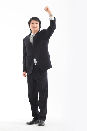 Asian businessman posing in the studio - isolated on whiteの写真素材