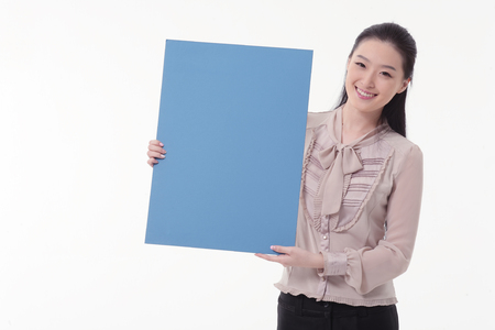 Asian business woman posing in the studio - isolated on whiteの写真素材