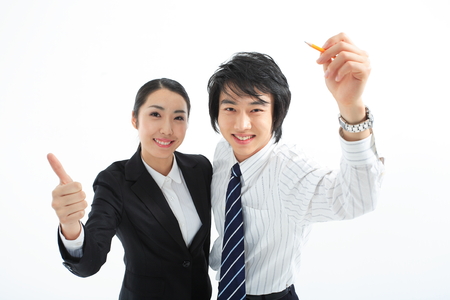 Asian business people posing in the studio - isolated on whiteの写真素材