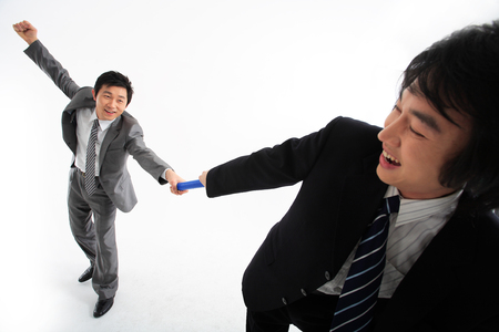 Two Asian businessmen posing in the studio - isolated on whiteの写真素材