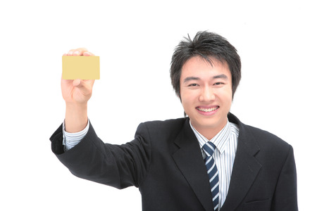Asian businessman posing in the studio - isolated on whiteの写真素材