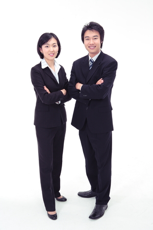 Asian business people standing straight - isolated on whiteの写真素材