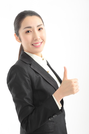 Asian businesswoman posing in the studio - isolated on whiteの写真素材