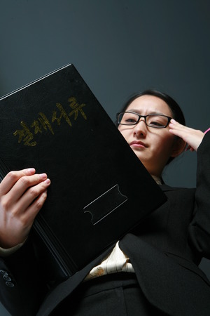 Young Asian business woman posing in the studio - isolated on whiteのeditorial素材