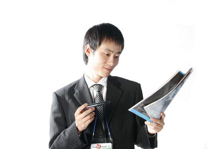 Young Asian businessman posing in the studio - isolated on whiteのeditorial素材