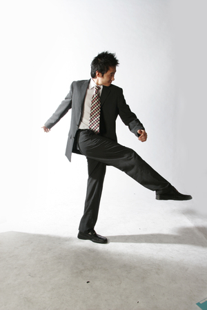 Young Asian businessman posing in the studio - isolated on whiteの写真素材