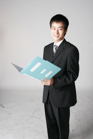 Young Asian businessman posing in the studio - isolated on whiteの写真素材