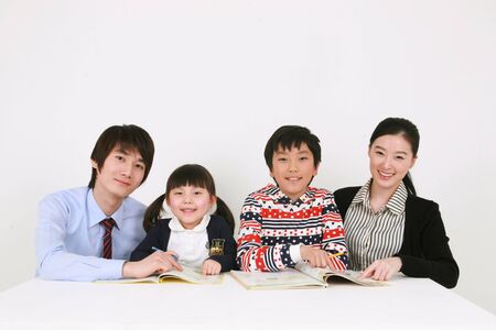 Two teachers and two kids studyingのeditorial素材