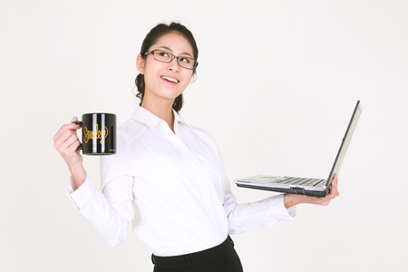 Young Asian businesswoman posing in the studio - isolated on whiteの写真素材