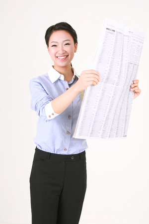 Young Asian business woman posing in the studio - isolated on whiteの写真素材