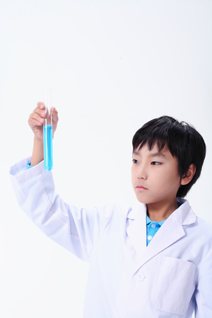 Children in a science class - isolated on whiteの写真素材