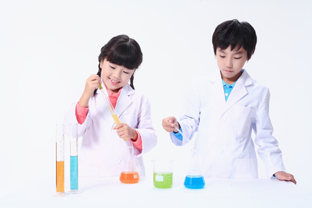 Children in a science class - isolated on whiteの写真素材