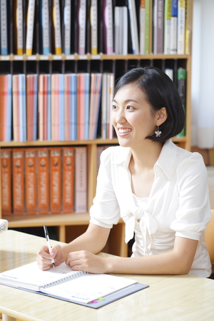 A teacher posing in a high school classroomの写真素材