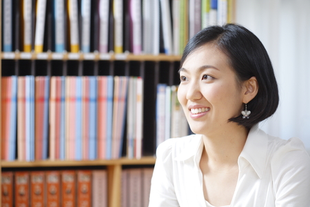 A teacher posing in a high school classroomの写真素材