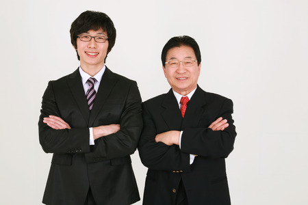 Three generation family celebrating graduation - isolated on whiteの写真素材