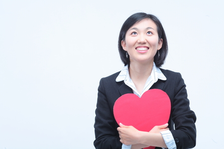 Young Asian businesswoman posing in the studio - isolated on whiteの写真素材