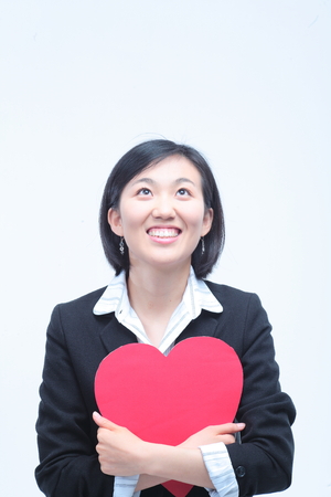 Young Asian businesswoman posing in the studio - isolated on whiteの写真素材