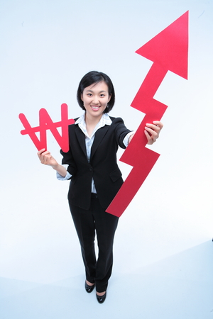 Young Asian businesswoman posing in the studio - isolated on whiteの写真素材