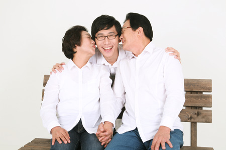 Three generation asian family dressed casually - isolated on whiteの写真素材
