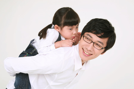 Three generation asian family dressed casually - isolated on whiteの写真素材