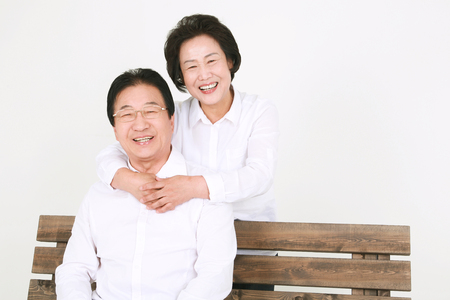 Three generation asian family dressed casually - isolated on whiteの写真素材