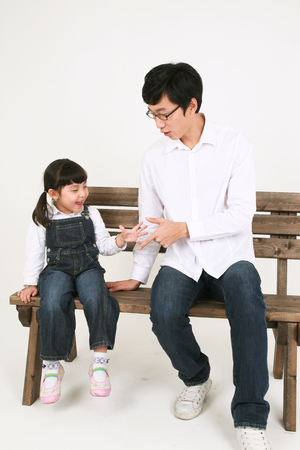 Three generation asian family dressed casually - isolated on whiteの写真素材