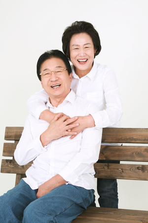 Three generation asian family dressed casually - isolated on whiteの写真素材