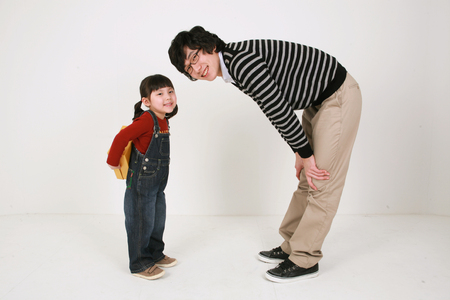 Asian young couple and a little girl - isolated on whiteの写真素材