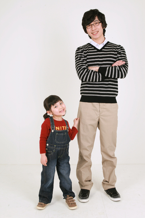 Asian young couple and a little girl - isolated on whiteの写真素材