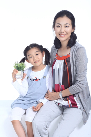 An asian happy family - isolated on whiteの写真素材