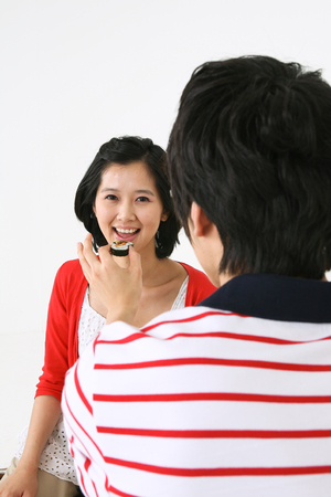 Young asian family picnic - isolated on whiteの写真素材