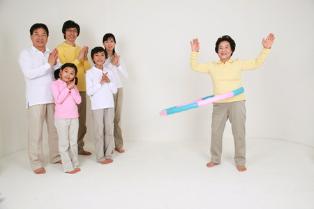 An asian big family dressed casually - isolated on whiteの写真素材