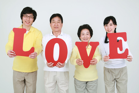 An asian big family dressed casually - isolated on whiteの写真素材