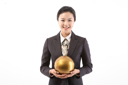 Asian businesswoman in uniform posing in the studio - isolated on whiteの写真素材