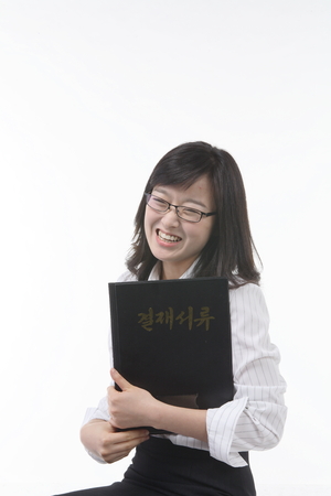 Asian businesswoman posing in the studio - isolated on whiteの写真素材