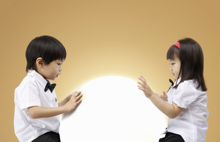 Asian kids with education concept- Isolated on studio shotの写真素材
