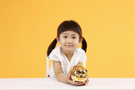 Asian kids with education concept- Isolated on studio shotの写真素材