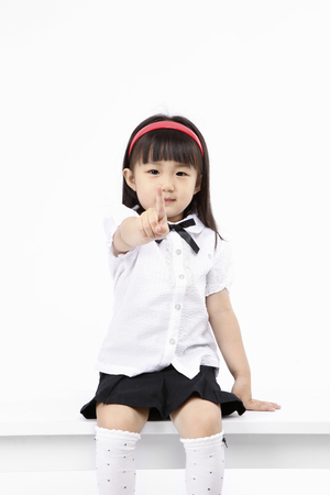 Asian kids with education concept- Isolated on studio shotの写真素材